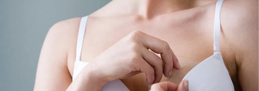A flat-chested woman trying to increase her breast size.
