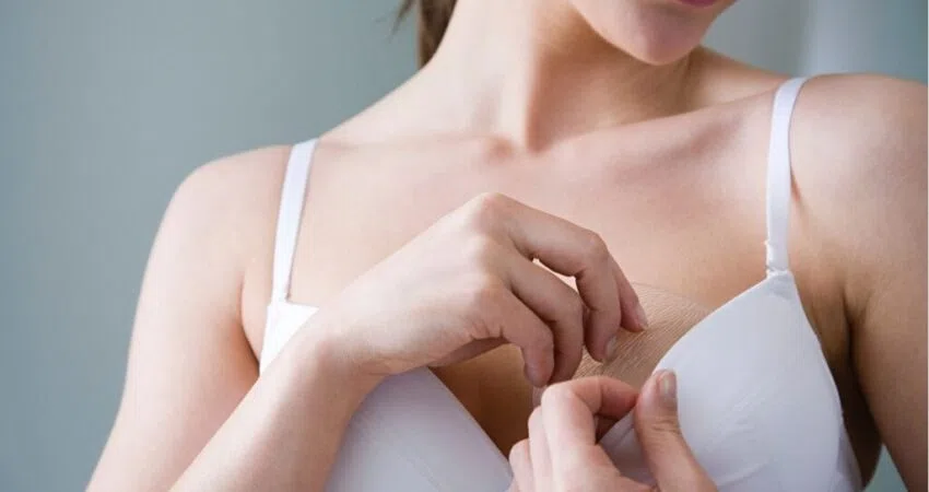 A flat-chested woman trying to increase her breast size.