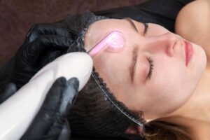 A woman undergoes a high-frequency facial.