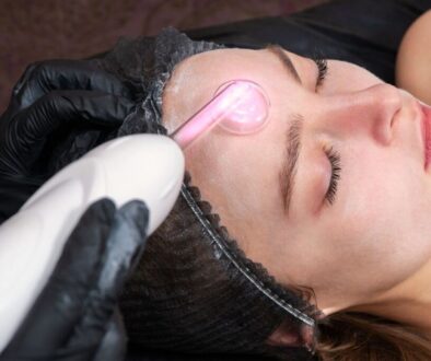 A woman undergoes a high-frequency facial.