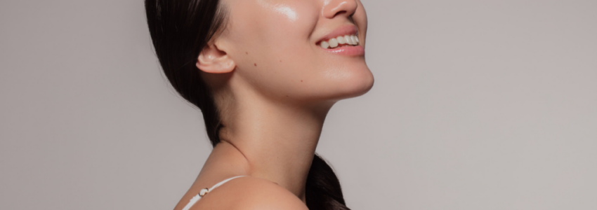 Woman smiling to show off her glowing skin