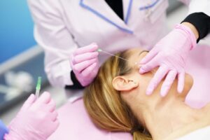 A woman undergoing a PDO threadlift treatment.