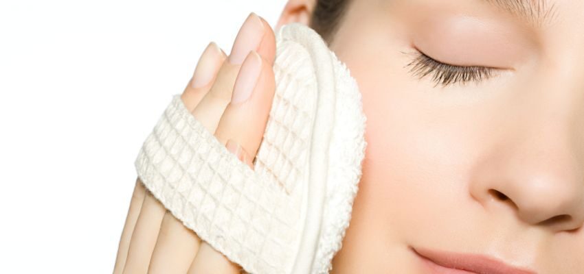 A woman exfoliates her skin two to three times per week.