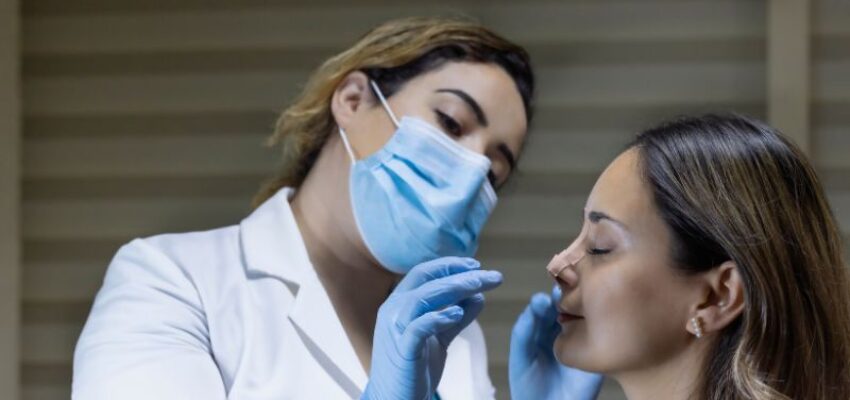 A woman after surgery for a smaller nose.