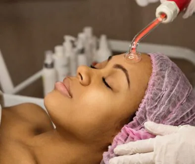 The woman undergoes a high-frequency facial.