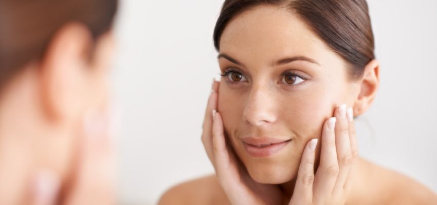 The woman has a smoother, brighter skin after dermaplaning.