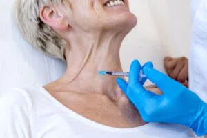 The woman undergoes neck botox to smooth out wrinkles.