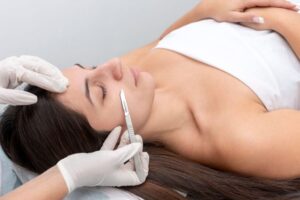 The woman feels relaxed while having a Dermaplane at home.