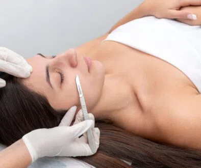 The woman feels relaxed while having a Dermaplane at home.