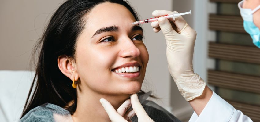 botox-injection-sites3 Skincare specialist examining botox injection sites on a woman's face.