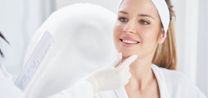botox-injection-sites4 A woman receiving a facial evaluation by a professional, identifying potential botox injection sites.