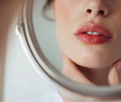 The woman wants to enhance the appearance of her lips.